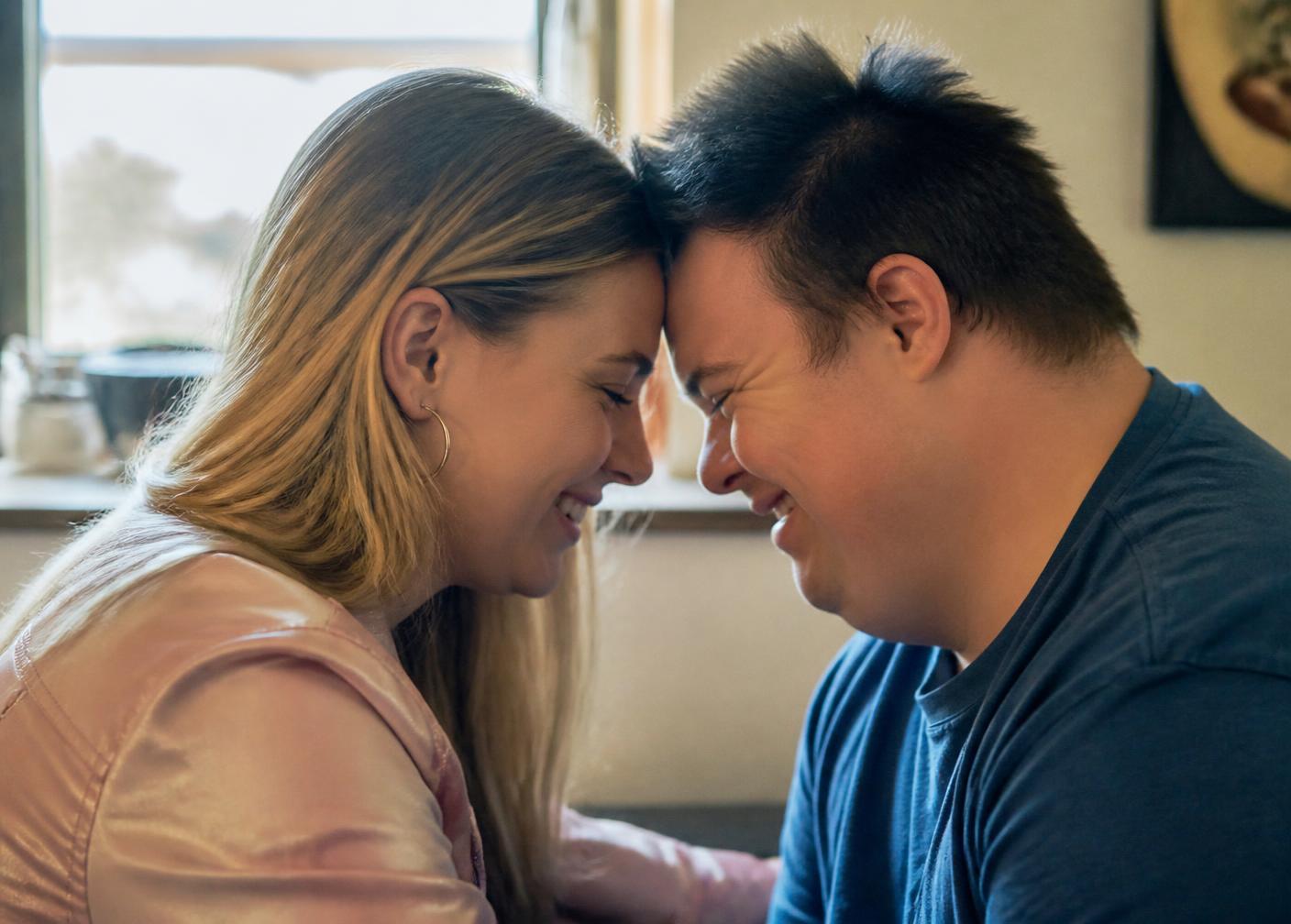 A couple sharing a tender moment, foreheads touching, after meeting on LOVTRN